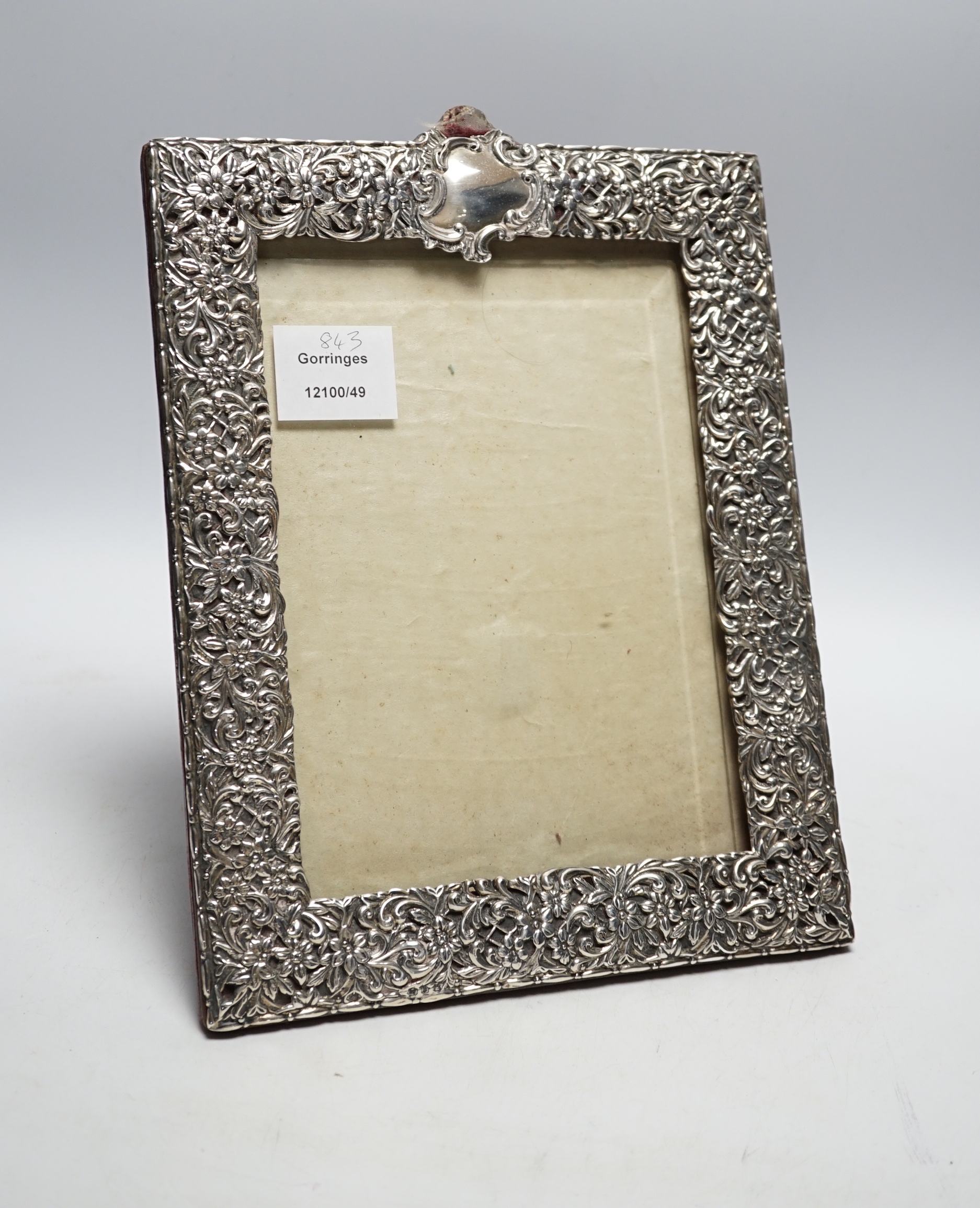 A late Victorian repousse silver mounted photograph frame, Birmingham, 1894, 29cm (a.f.)